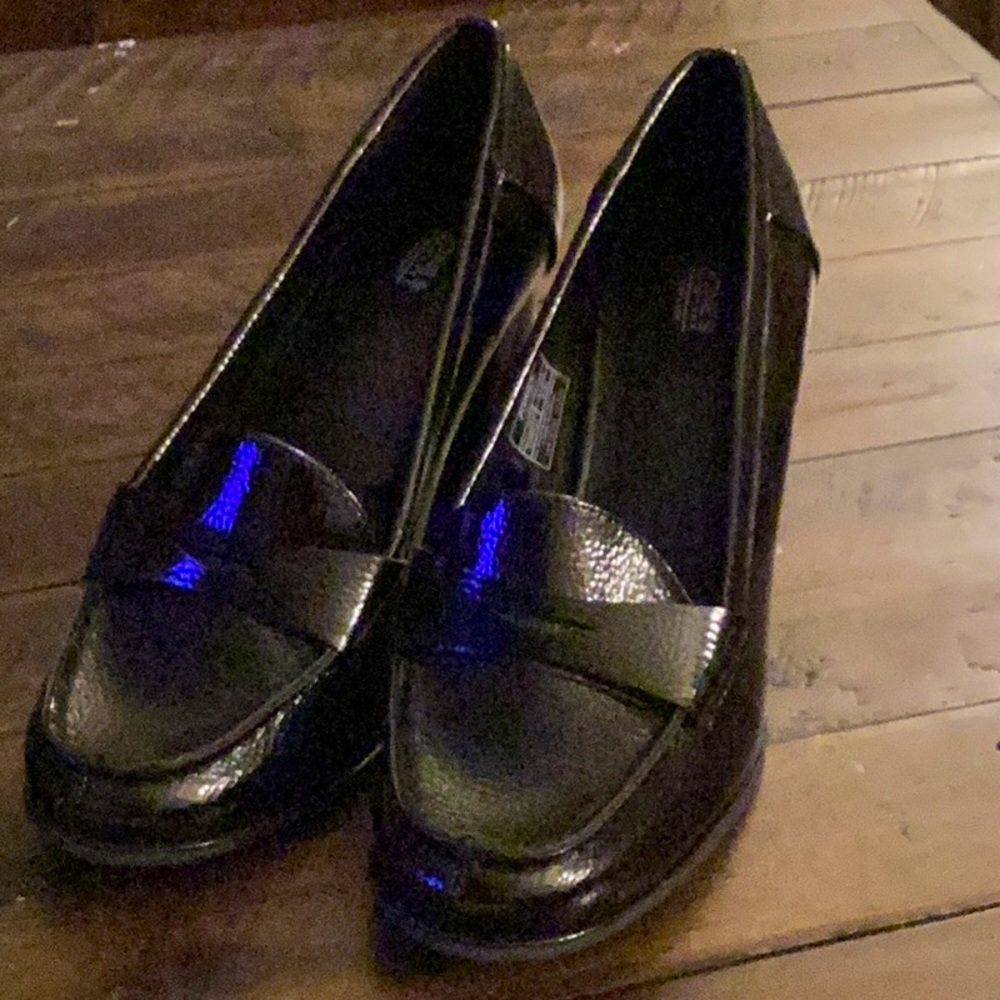 New patent leather Mary Jane style heels. Never worn. 1/2 size too big.